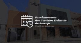 Imagem de um prédio institucional moderno, visto de frente, com fachada clara e detalhes em verd...